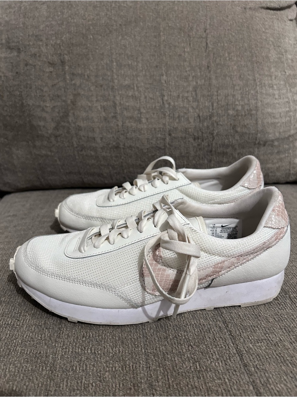 Nike White Low-Top Sneakers with Pale Pink Swoosh